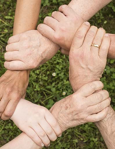 Hands holding eachother, community spirit